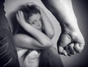 Woman victim of domestic violence and abuse. Husband intimidates his wife. Focus on hand
