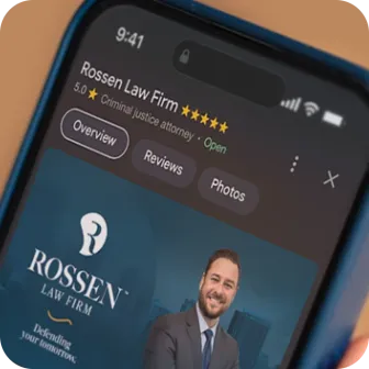 Mobile phone showing Rossen Law Firm five-star reviews