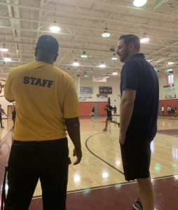 Adam, Manny, and PBSO Deputy Kenneth Torrence (Coach T) posing together at the Tri-City Basketball, Academics and Mentoring Camp in Belle Glade, Florida