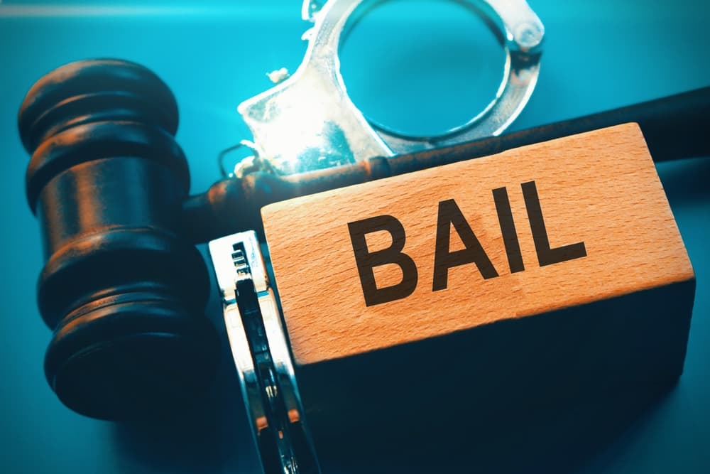 Conceptual image representing a criminal defendant's agreement to appear in court for trial or to pay a court-set bail amount as a condition of release.
