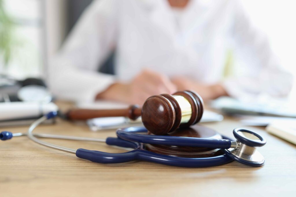 gavel laying on stethoscope gavel laying on stethoscope