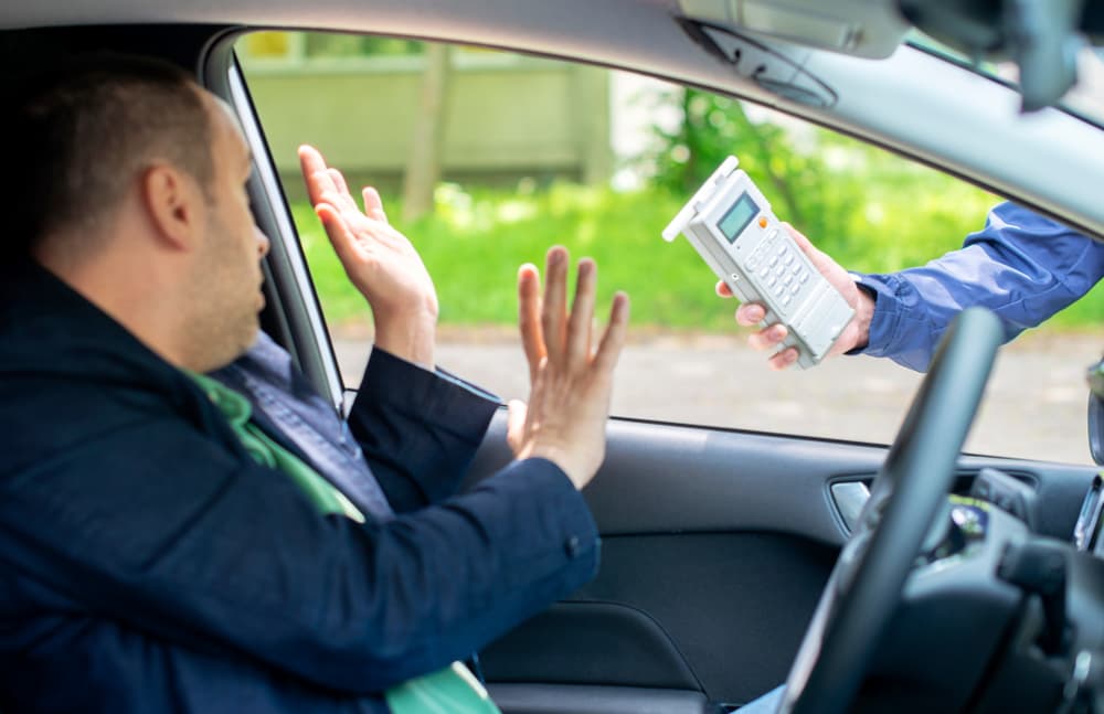 Driver required to undergo a breathalyzer test to measure blood alcohol content.