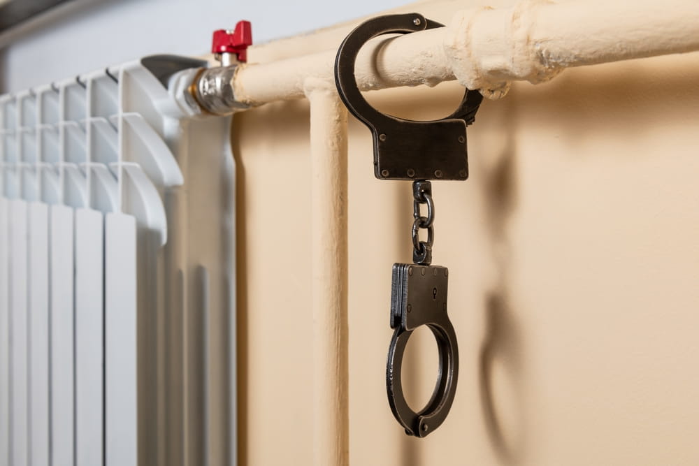 Handcuffs symbolizing potential jail time for assault or battery conviction in Broward County