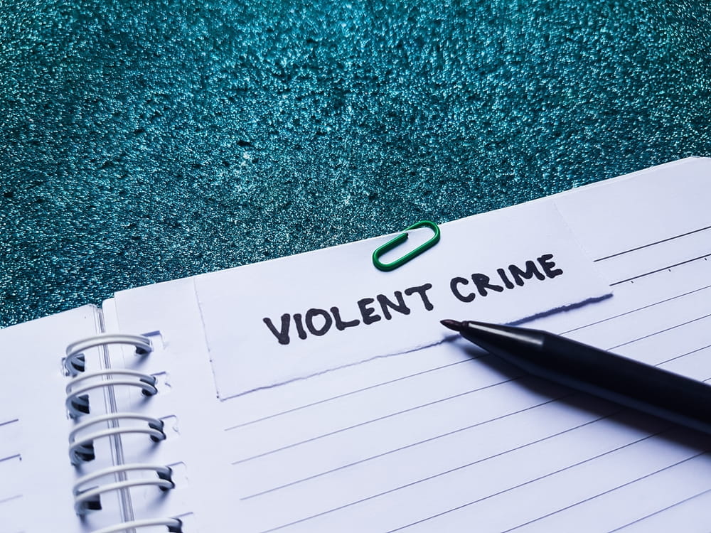 Notebook labeled violent crime representing assault and battery defense in Florida